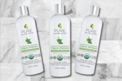 pure organic pet shampoo bottles on tiled floor
