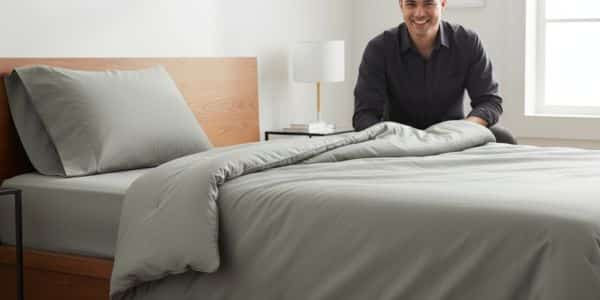 James Miller testing the Quince organic cotton comforter